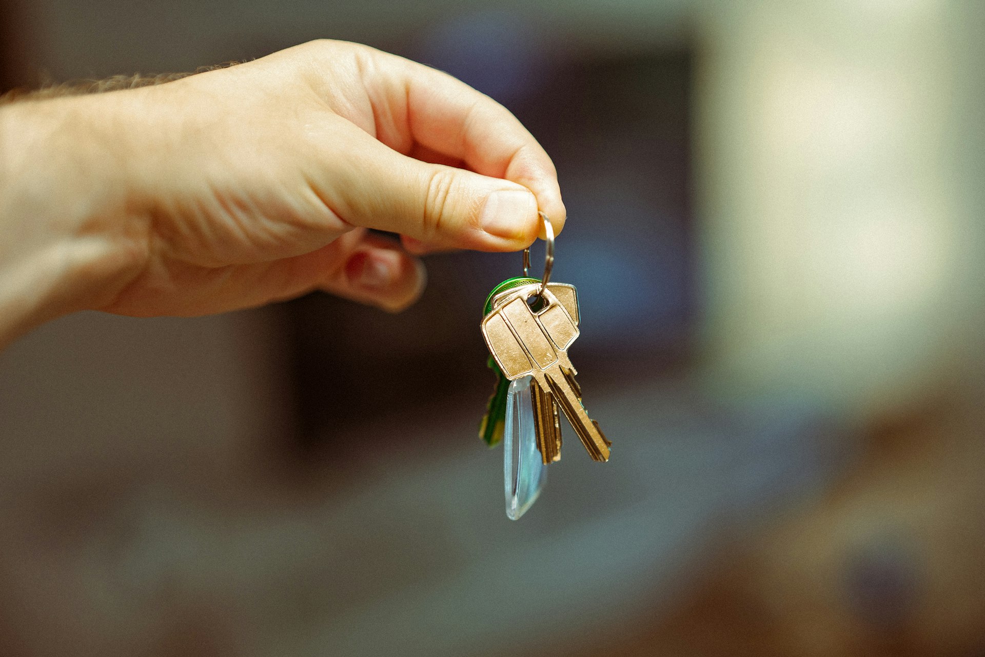 A person holding a bunch of keys in their hand